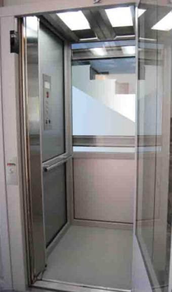 Glass elevator cabin with stainless steel finish by Arkown